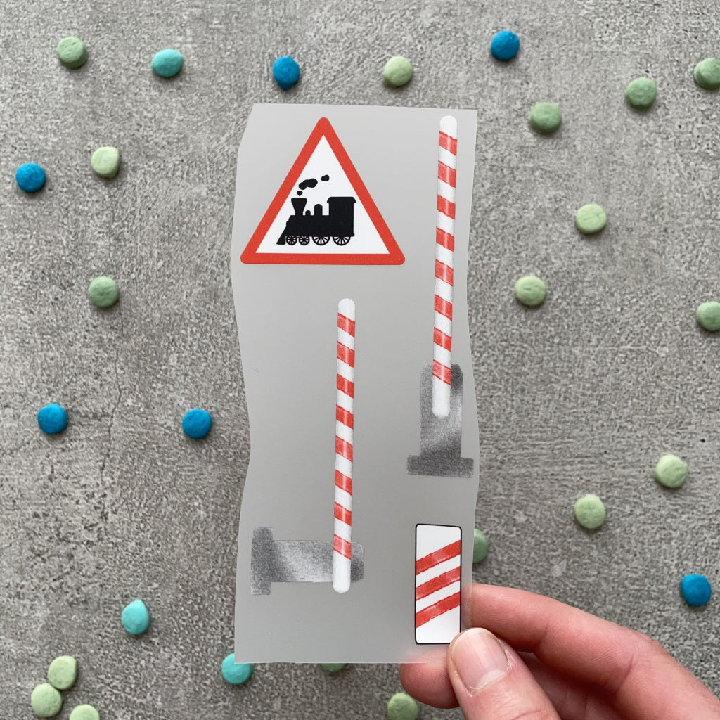 Bügelbild Schranken, Bahnübergang und Bake