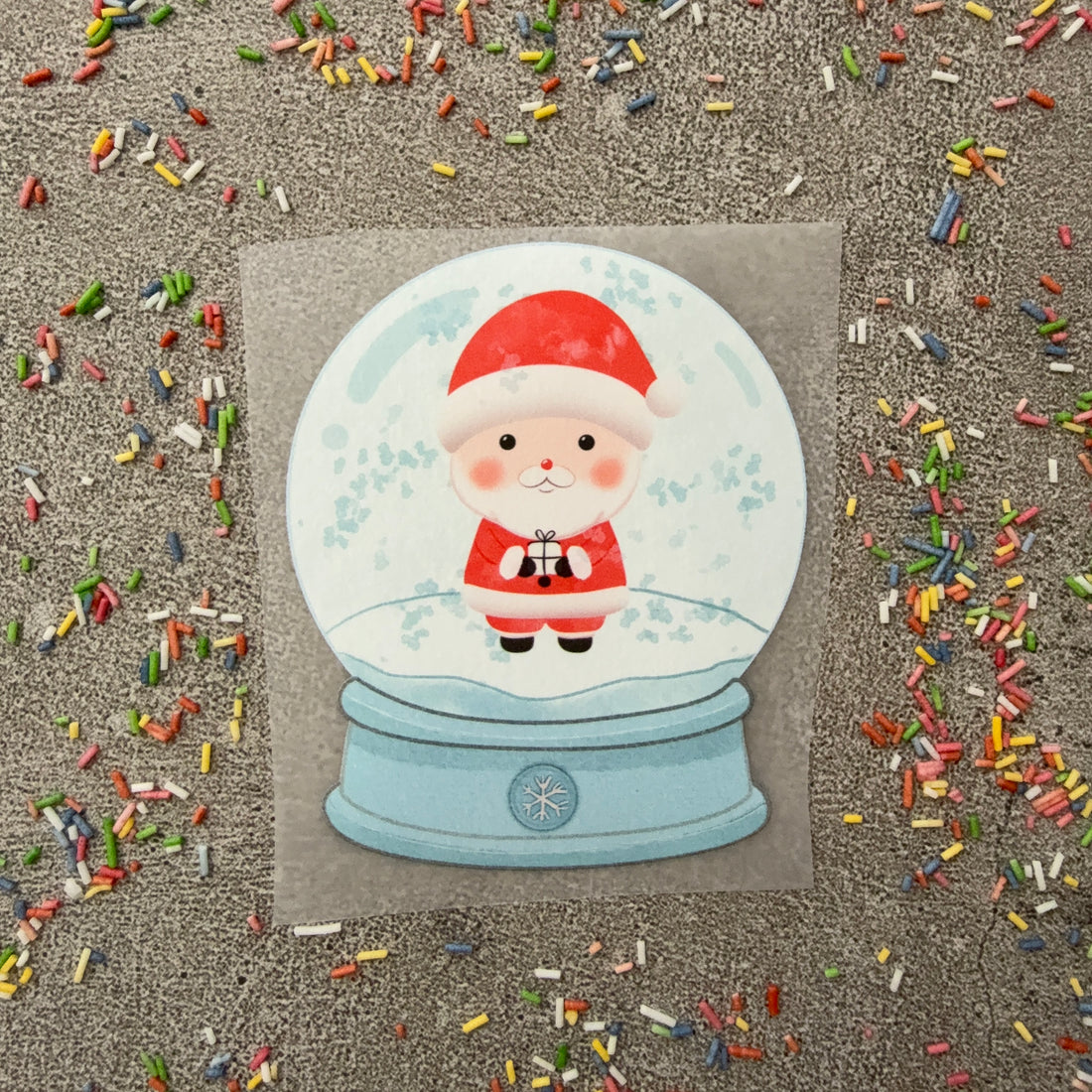 Bügelbild Weihnachtsmann in der Schneekugel